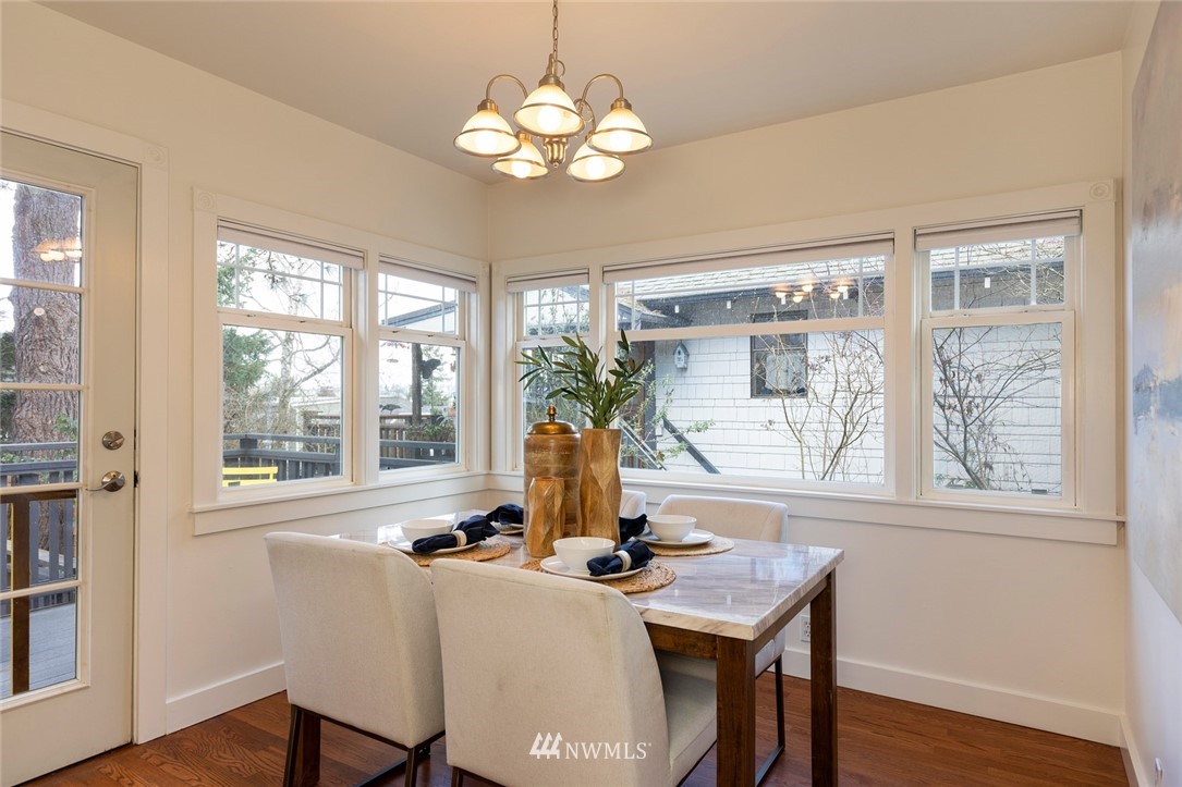 708 North 63rd Street Seattle, WA 98103 - Photo 12 of 24 a view of a dining room with furniture window and outside view