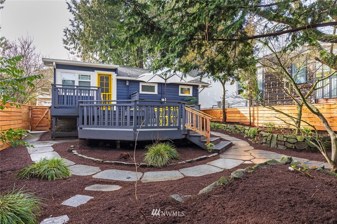 708 North 63rd Street Seattle, WA 98103 - Photo 22 of 24 a view of a house with a yard