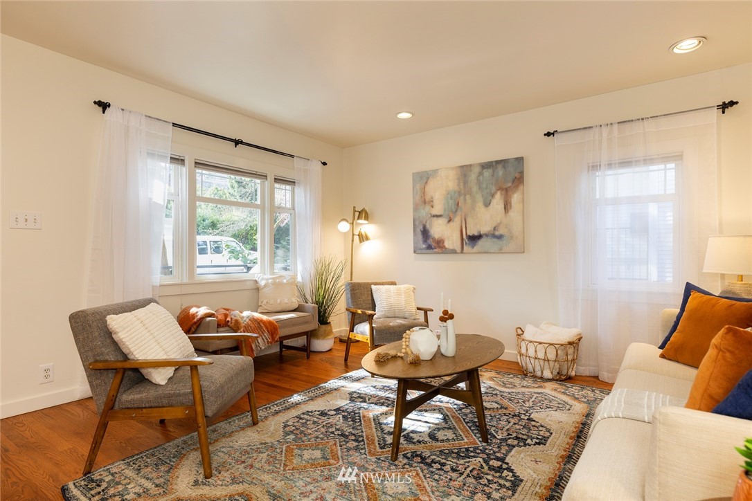 708 North 63rd Street Seattle, WA 98103 - Photo 4 of 24 a living room with furniture and a window