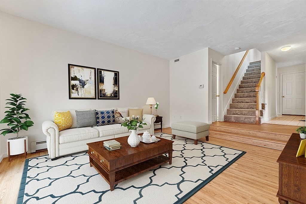 11 Longley Road, Unit I1 Shirley, MA 01464 - Photo 11 of 28 a living room with furniture and wooden floor