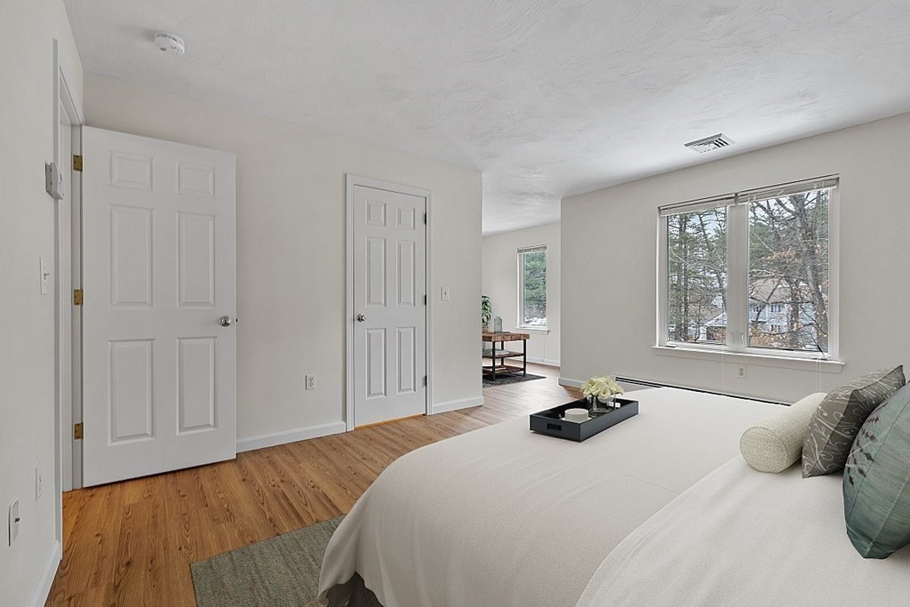 11 Longley Road, Unit I1 Shirley, MA 01464 - Photo 14 of 28 a bedroom with a bed and a window