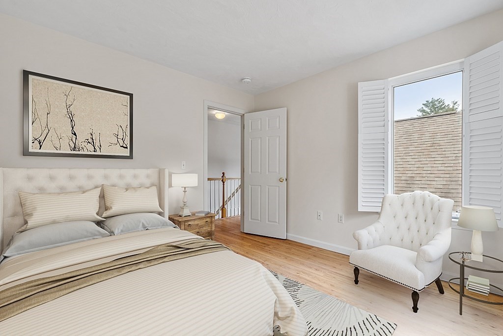 11 Longley Road, Unit I1 Shirley, MA 01464 - Photo 16 of 28 a spacious bedroom with a bed a couch and a couch