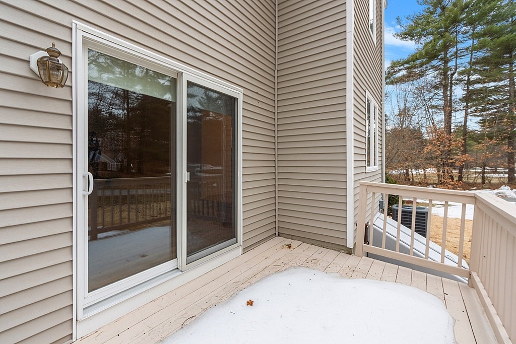 11 Longley Road, Unit I1 Shirley, MA 01464 - Photo 20 of 28 a view of a balcony with a potted plant