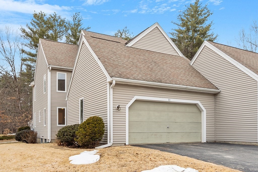 11 Longley Road, Unit I1 Shirley, MA 01464 - Photo 2 of 28 a front view of a house