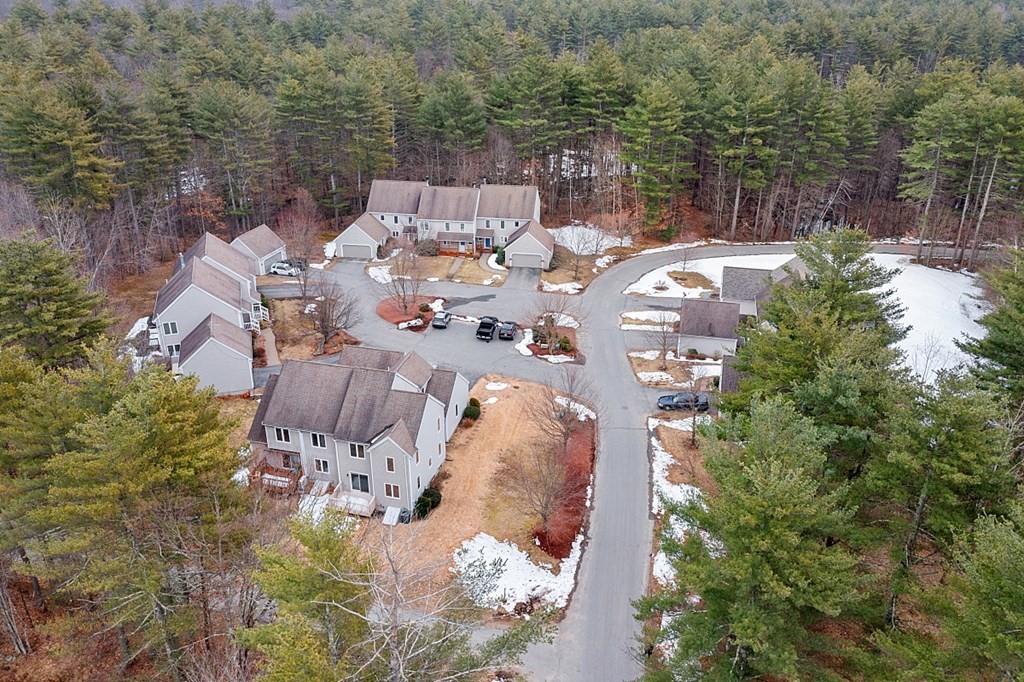 11 Longley Road, Unit I1 Shirley, MA 01464 - Photo 25 of 28 an aerial view of a house with a yard and lake view