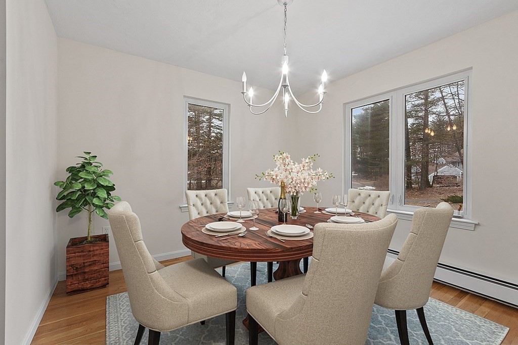 11 Longley Road, Unit I1 Shirley, MA 01464 - Photo 7 of 28 a view of a dining room with furniture window and wooden floor