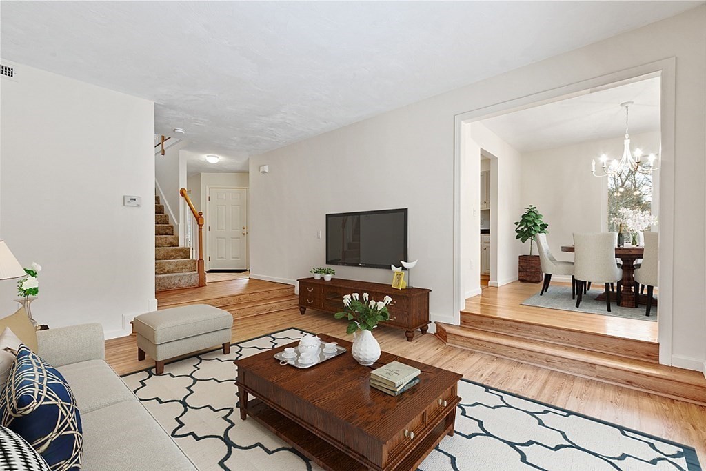 11 Longley Road, Unit I1 Shirley, MA 01464 - Photo 9 of 28 a living room with furniture and a flat screen tv