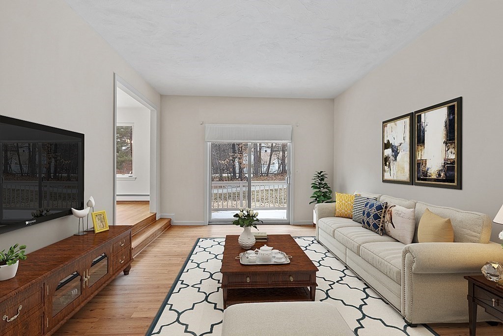 11 Longley Road, Unit I1 Shirley, MA 01464 - Photo 10 of 28 a living room with furniture and a flat screen tv