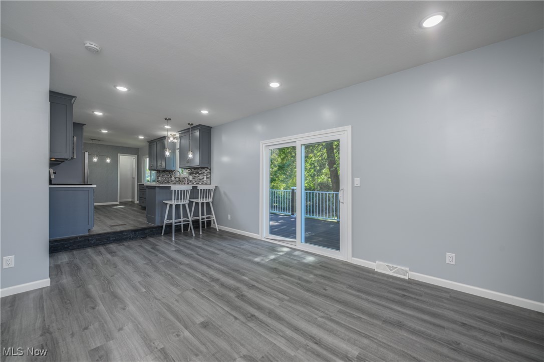 3012 Shellhart Road Barberton, OH 44203 - Photo 13 of 28 Living area featuring dark wood-style flooring and recessed lighting