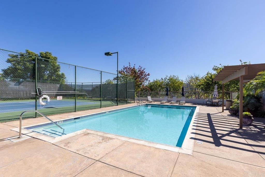866 South Rancho Santa Fe Road, Unit C San Marcos, CA 92078 - Photo 12 of 14 a view of a swimming pool with a lounge chairs