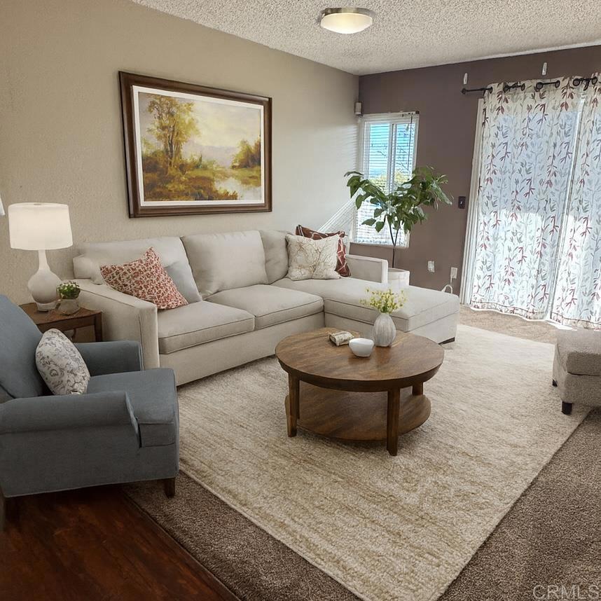 866 South Rancho Santa Fe Road, Unit C San Marcos, CA 92078 - Photo 2 of 14 a living room with furniture and a large window