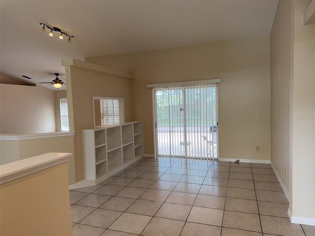 9717 Crenshaw Circle Clermont, FL 34711 - Photo 2 of 11 a view of an empty room and a window