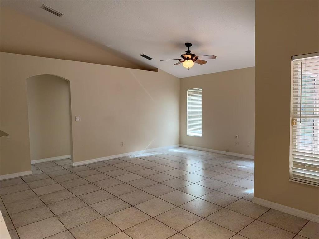 9717 Crenshaw Circle Clermont, FL 34711 - Photo 4 of 11 a view of an empty room with a window