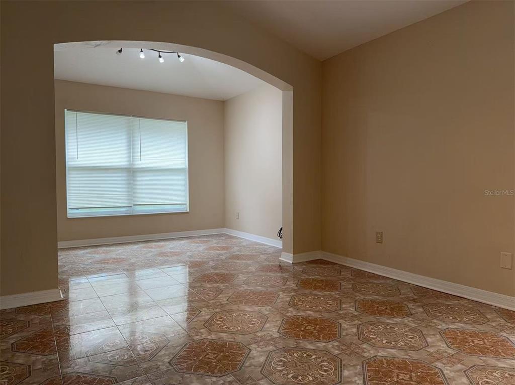 9717 Crenshaw Circle Clermont, FL 34711 - Photo 6 of 11 an empty room with windows and closet
