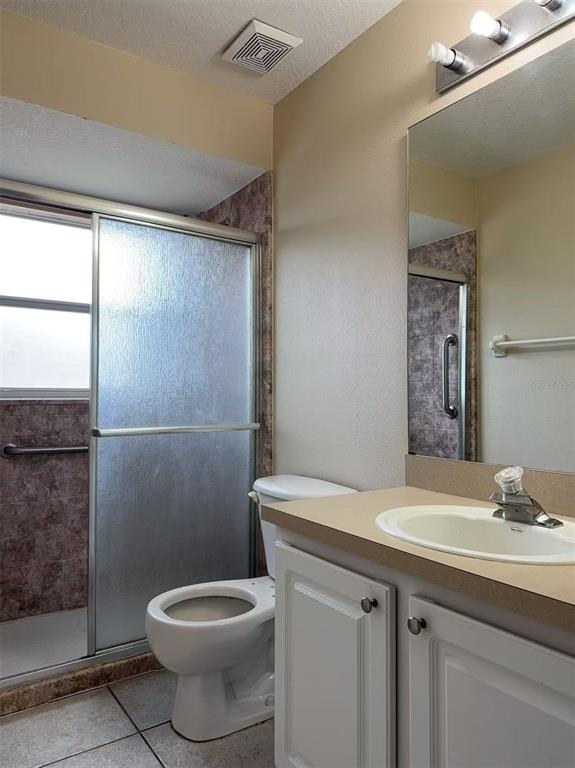 9717 Crenshaw Circle Clermont, FL 34711 - Photo 10 of 11 a bathroom with a sink toilet and shower