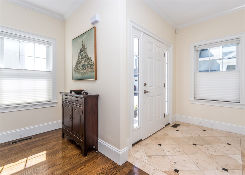 128 Church Street, Unit 2 Waltham, MA 02452 - Photo 3 of 41 a view of livingroom with hallway and window