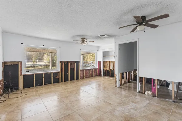 a large room with furniture and a large window