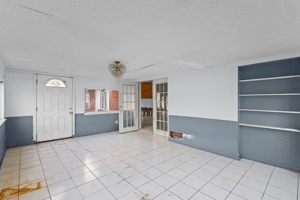 a hallway with wooden cabinets
