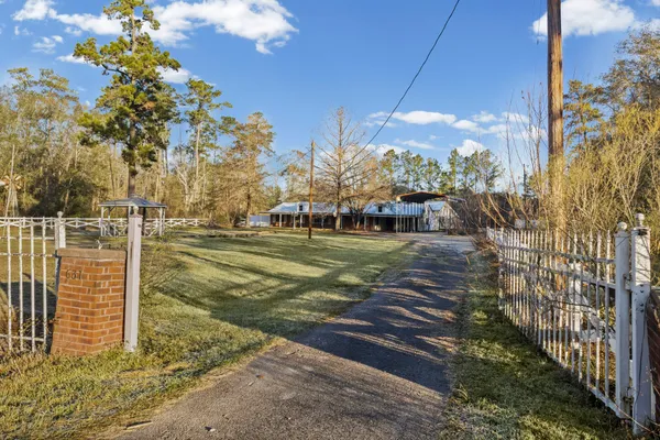 a view of a pathway with a yard