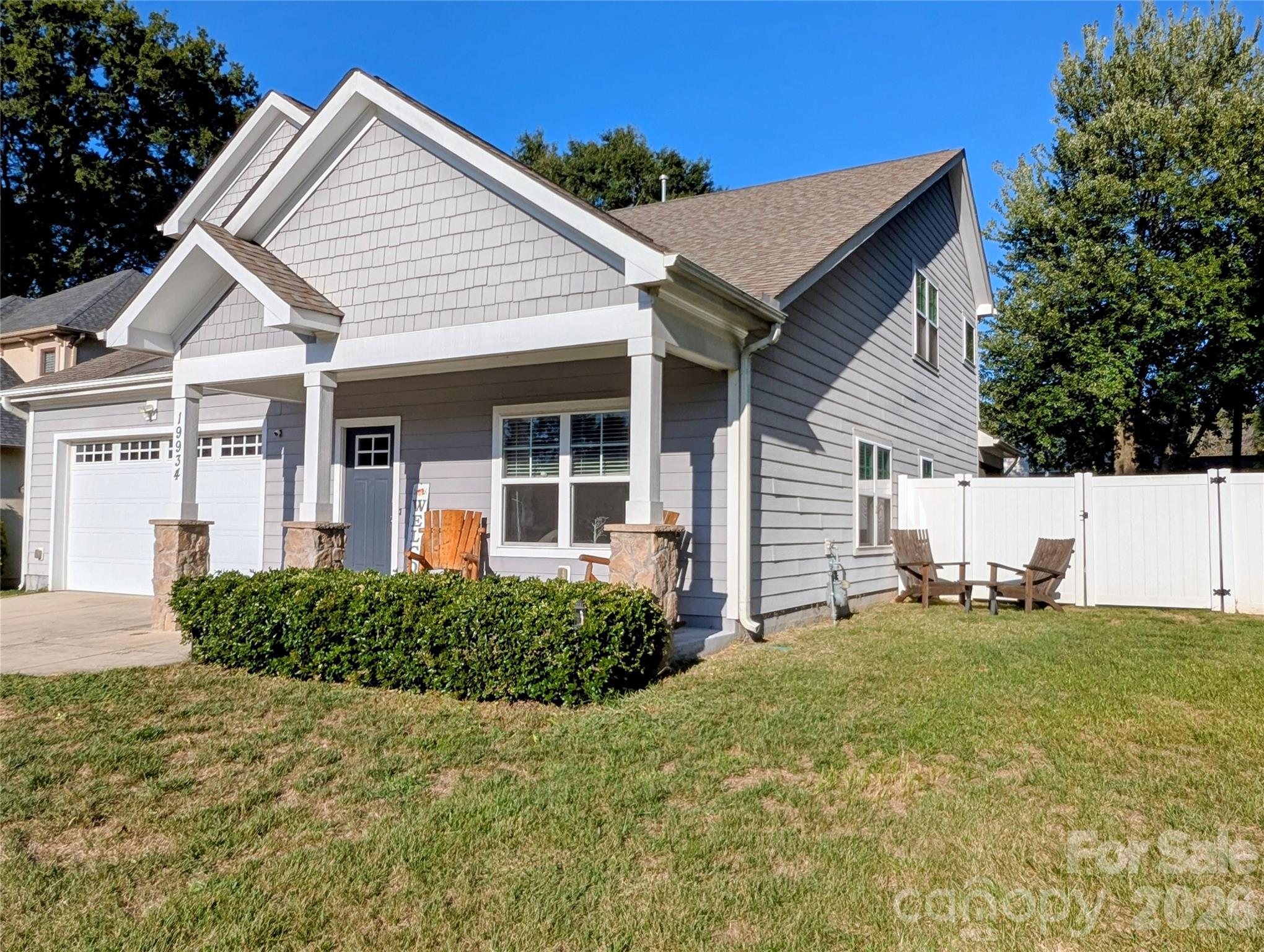 19934 Walter Henderson Road Cornelius, NC 28031 - Photo 2 of 35 a front view of a house with a yard