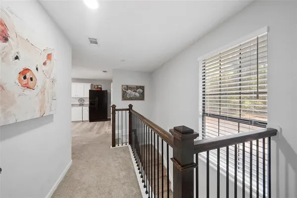 a view of a hallway with workspace