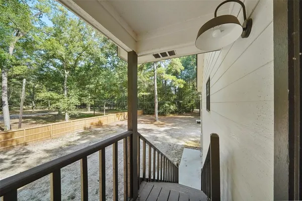 a view of a balcony with an outdoor space
