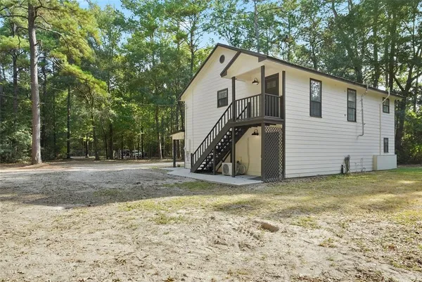 a view of a house with backyard