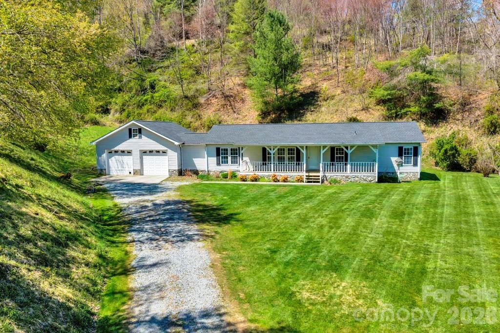 228 Vilas Overlook, Unit 1 Vilas, NC 28692 - Photo 2 of 48 a front view of house with yard and green space