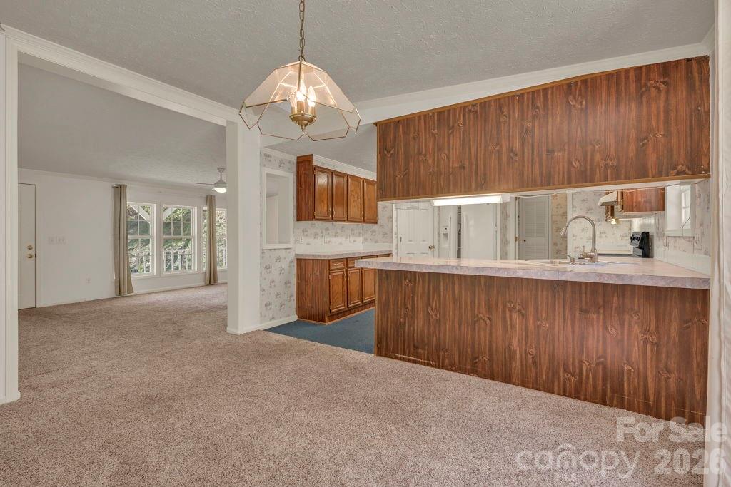 228 Vilas Overlook, Unit 1 Vilas, NC 28692 - Photo 22 of 48 a open kitchen with cabinets a sink and dishwasher