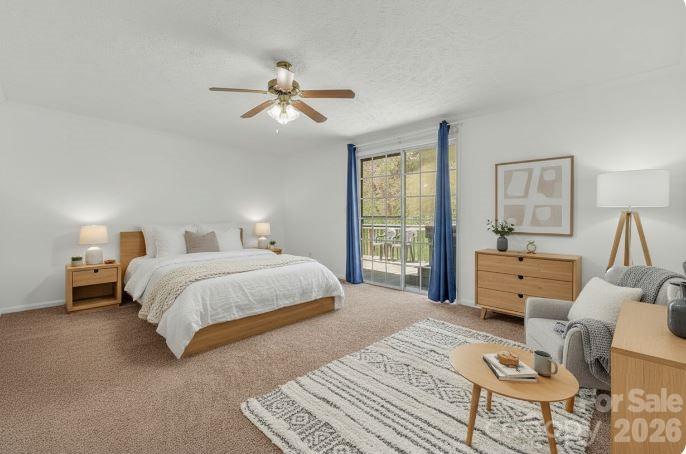 228 Vilas Overlook, Unit 1 Vilas, NC 28692 - Photo 33 of 48 a bedroom with a bed and wooden floor