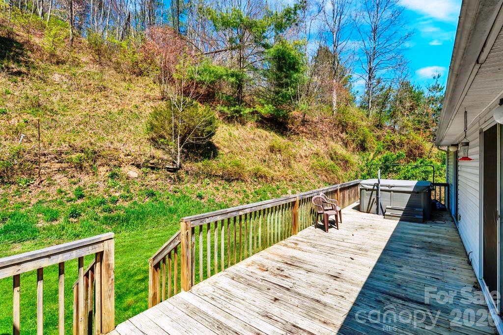228 Vilas Overlook, Unit 1 Vilas, NC 28692 - Photo 9 of 48 a view of balcony and wooden floor