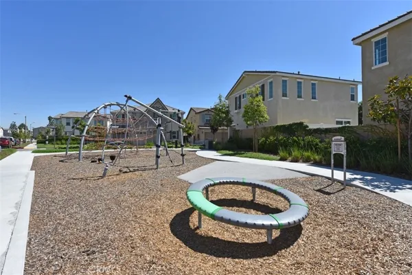 a front view of a house with a yard and porch