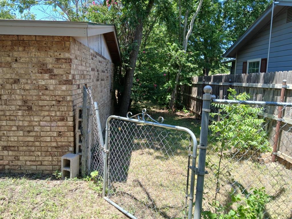 2010 Nowlin Road Coleman, TX 76834 - Photo 5 of 7 a front view of a house with a yard