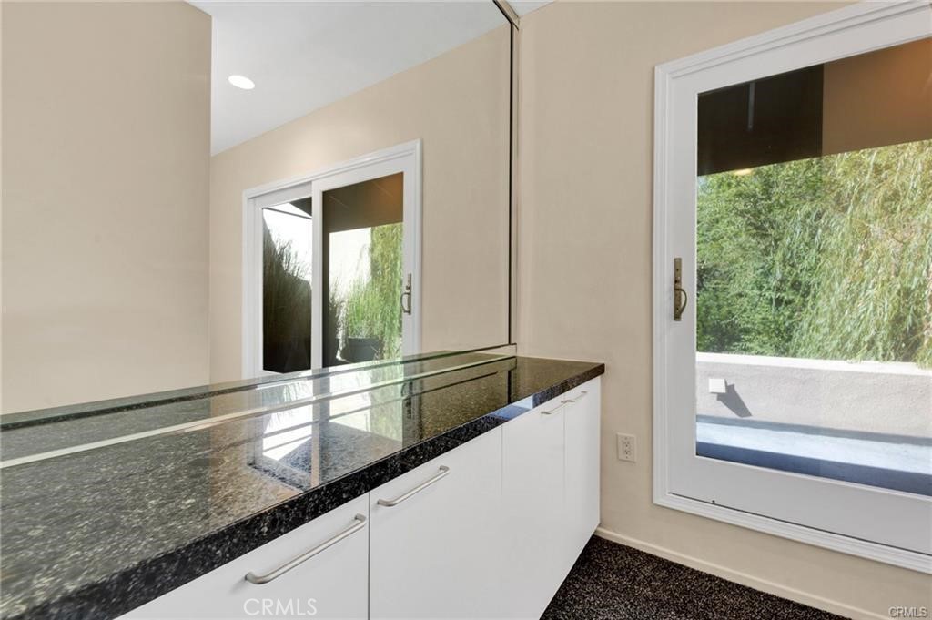 5084 Campo Road Los Angeles, CA 91364 - Photo 14 of 29 a kitchen with granite countertop a sink and a large window