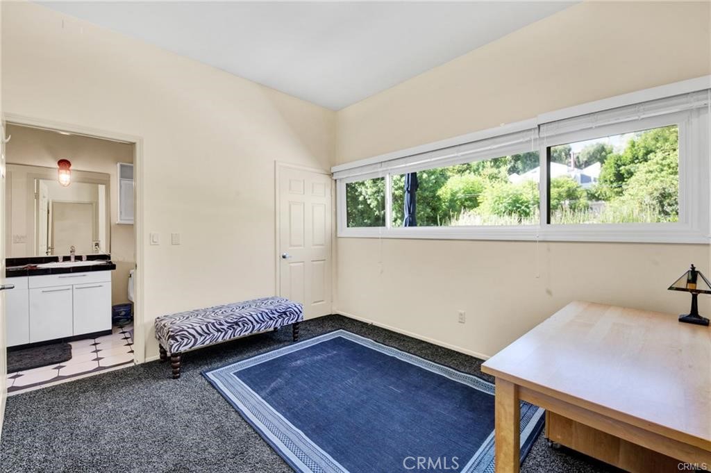 5084 Campo Road Los Angeles, CA 91364 - Photo 16 of 29 a bedroom with a bed and a window