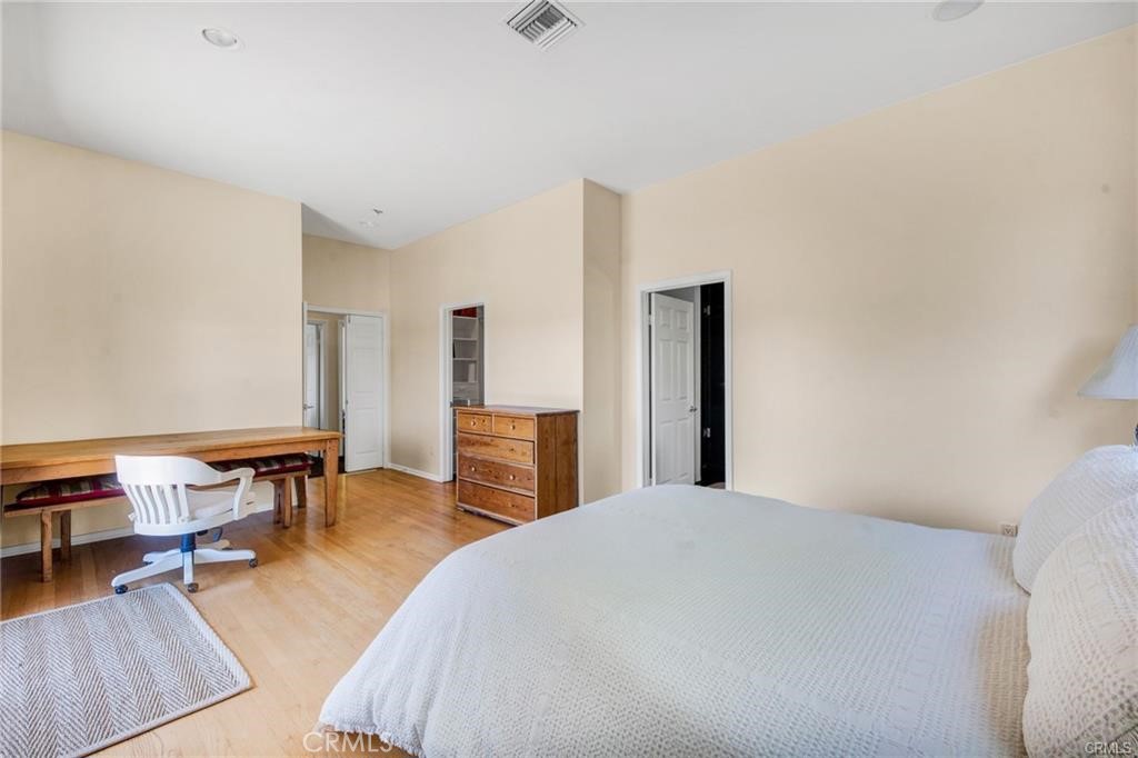 5084 Campo Road Los Angeles, CA 91364 - Photo 21 of 29 a bedroom with furniture and a wooden floor