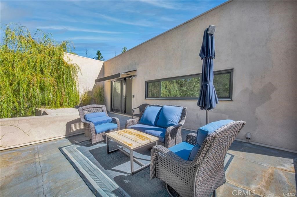 5084 Campo Road Los Angeles, CA 91364 - Photo 27 of 29 a living room with furniture and a large window