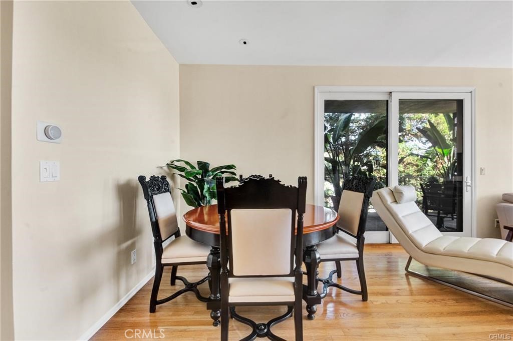 5084 Campo Road Los Angeles, CA 91364 - Photo 4 of 29 a view of a dining room with furniture window and wooden floor