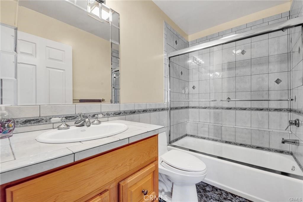 5084 Campo Road Los Angeles, CA 91364 - Photo 10 of 29 a bathroom with a sink toilet and shower