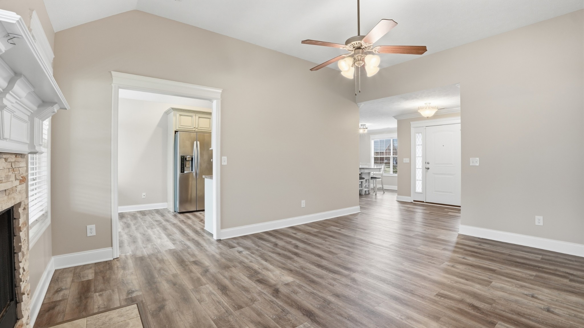 2422 Turtle Trace Murfreesboro, TN 37127 - Photo 11 of 38 a view of an empty room with wooden floor and a ceiling fan