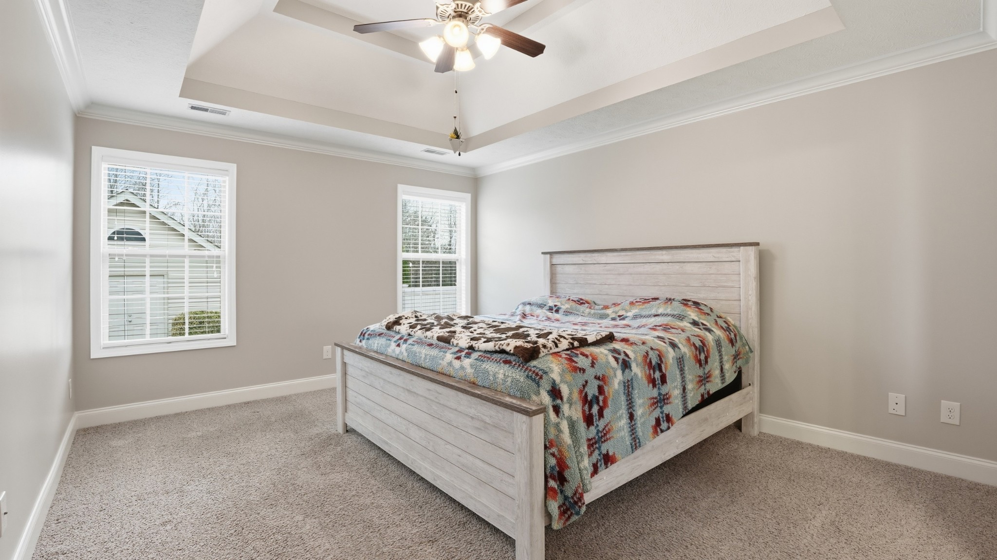 2422 Turtle Trace Murfreesboro, TN 37127 - Photo 19 of 38 a bed sitting in a bedroom next to a window and a chandelier