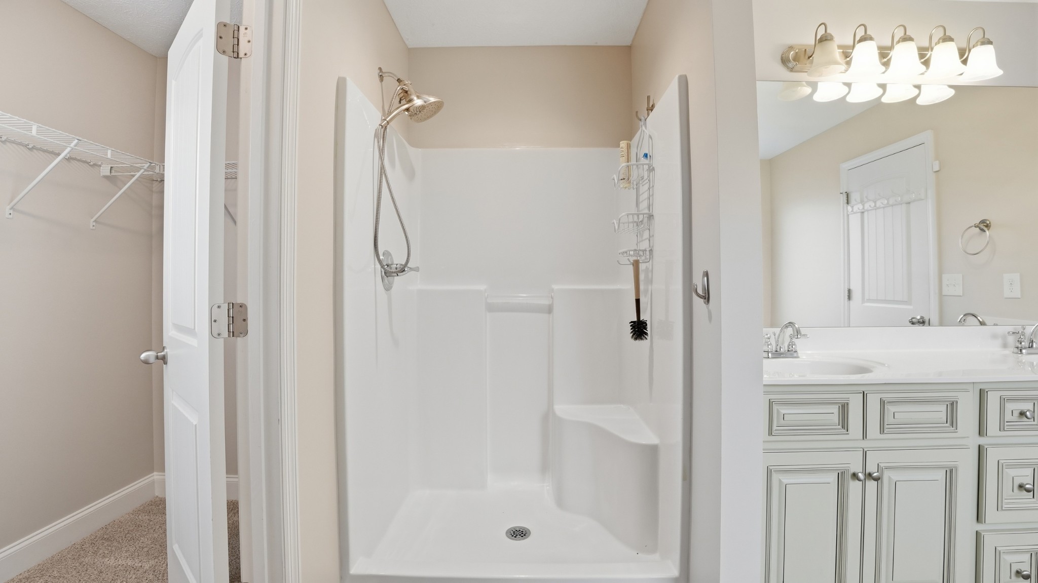 2422 Turtle Trace Murfreesboro, TN 37127 - Photo 24 of 38 a bathroom with a granite countertop sink a mirror and a shower