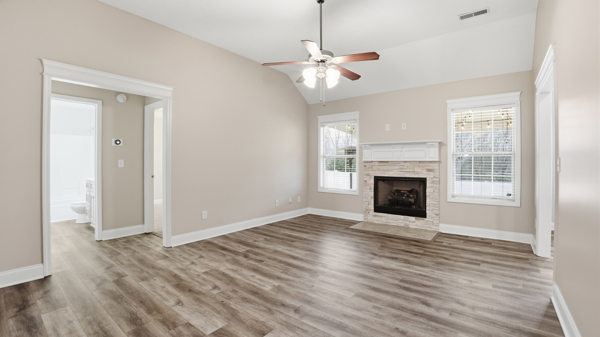 2422 Turtle Trace Murfreesboro, TN 37127 - Photo 10 of 38 a view of an empty room with wooden floor fireplace and a window