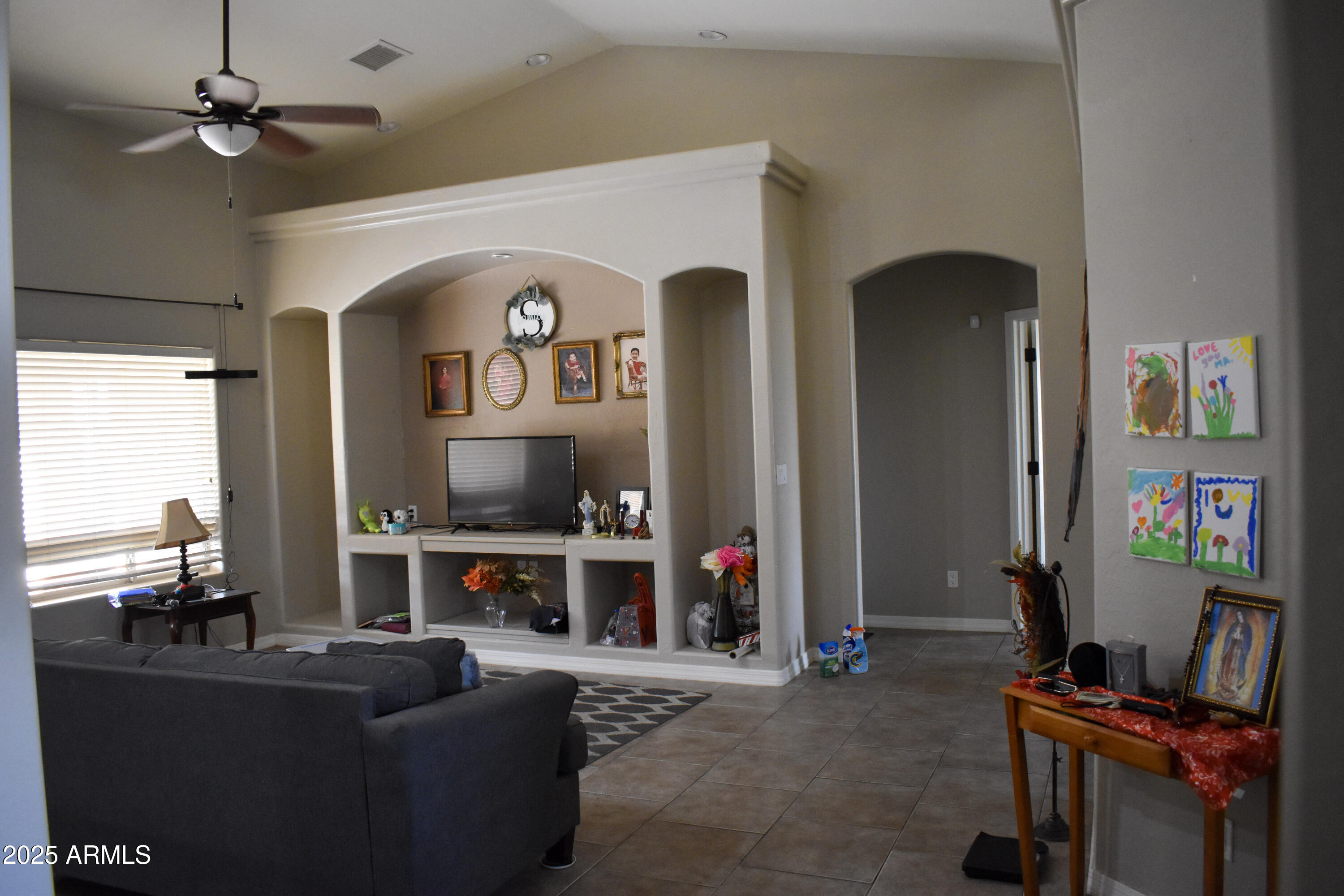 15641 Coral Road Arizona City, AZ 85123 - Photo 4 of 10 a living room with furniture and a flat screen tv