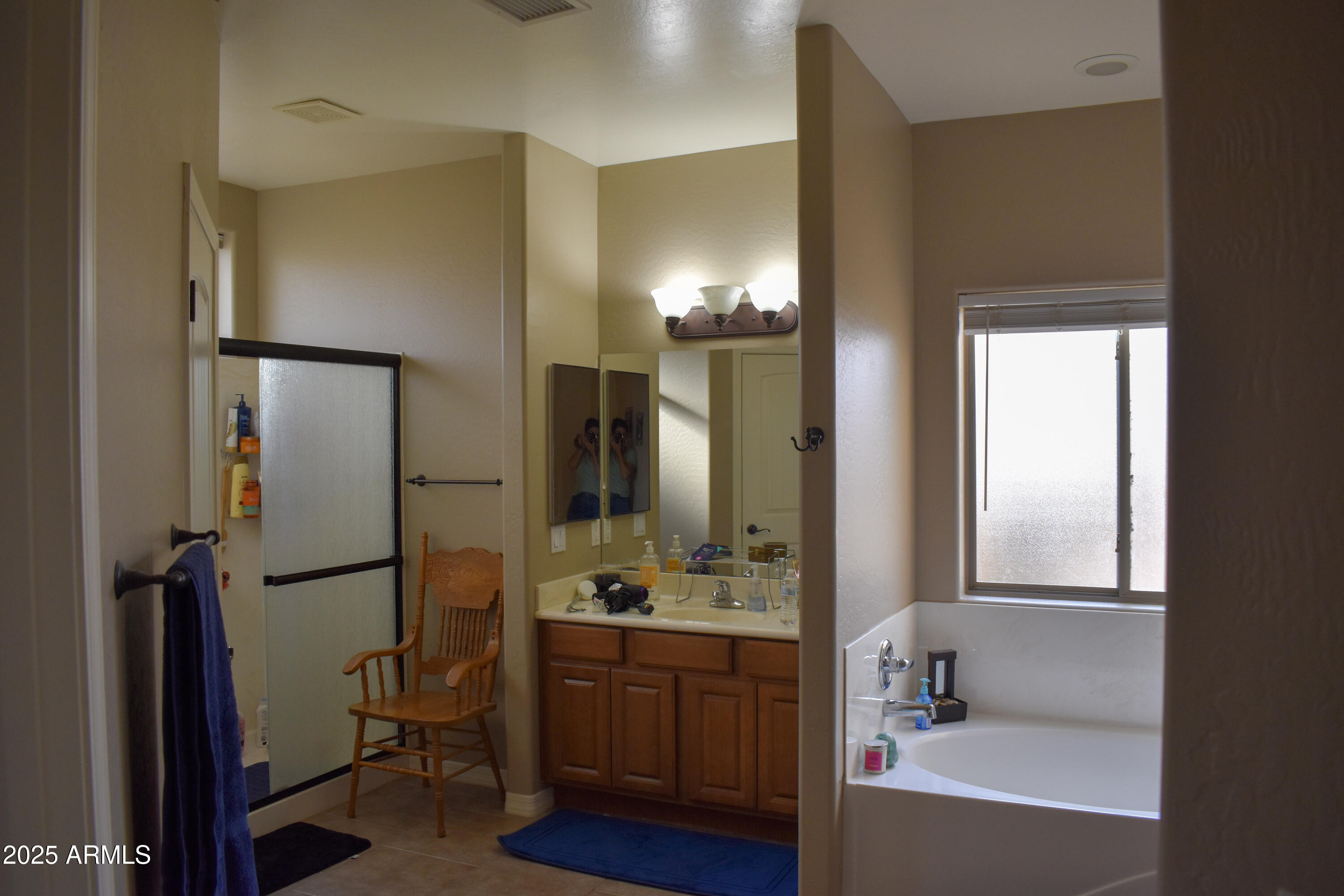 15641 Coral Road Arizona City, AZ 85123 - Photo 6 of 10 a bathroom with a tub sink and mirror