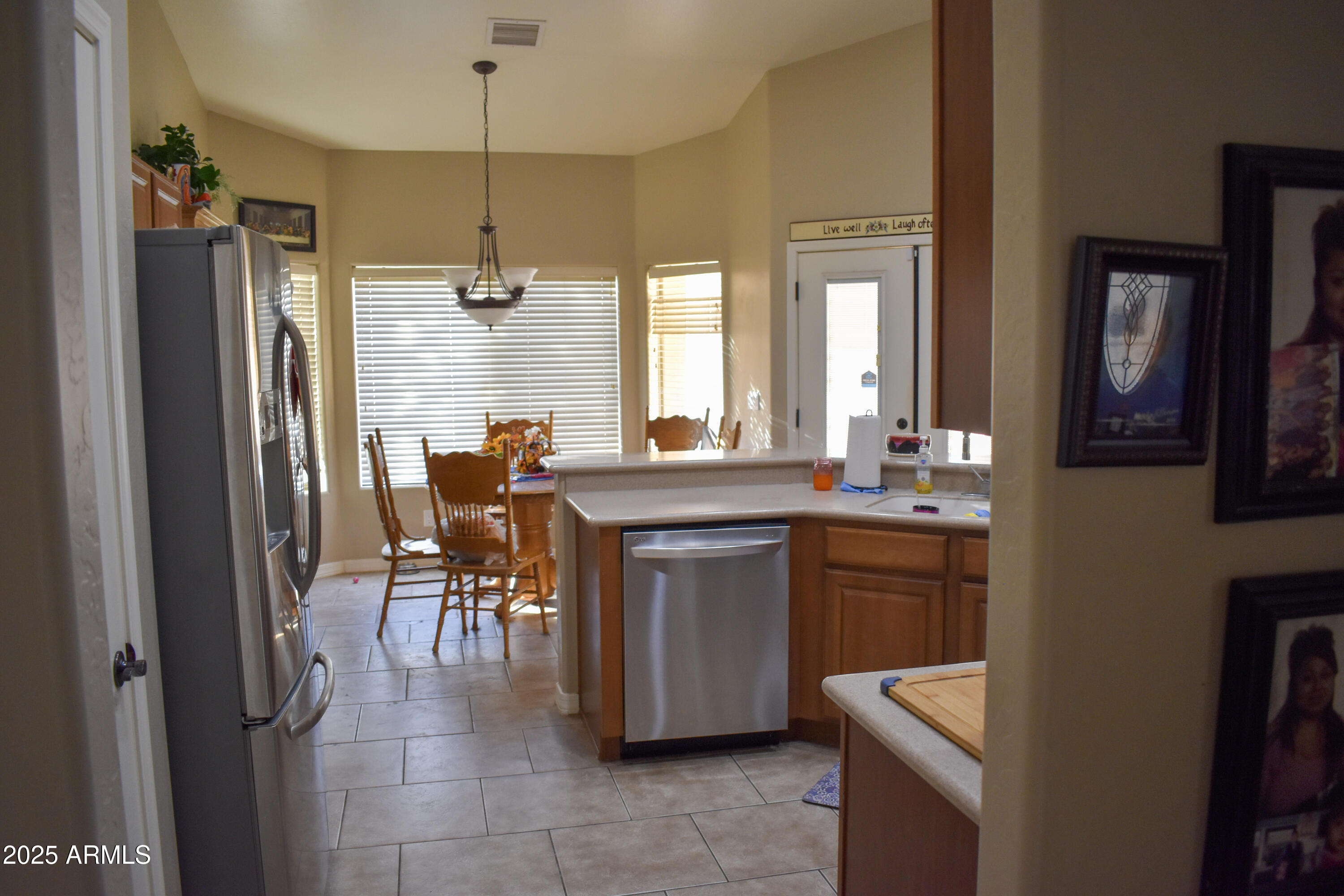 15641 Coral Road Arizona City, AZ 85123 - Photo 9 of 10 a dining hall with stainless steel appliances granite countertop a refrigerator and a sink