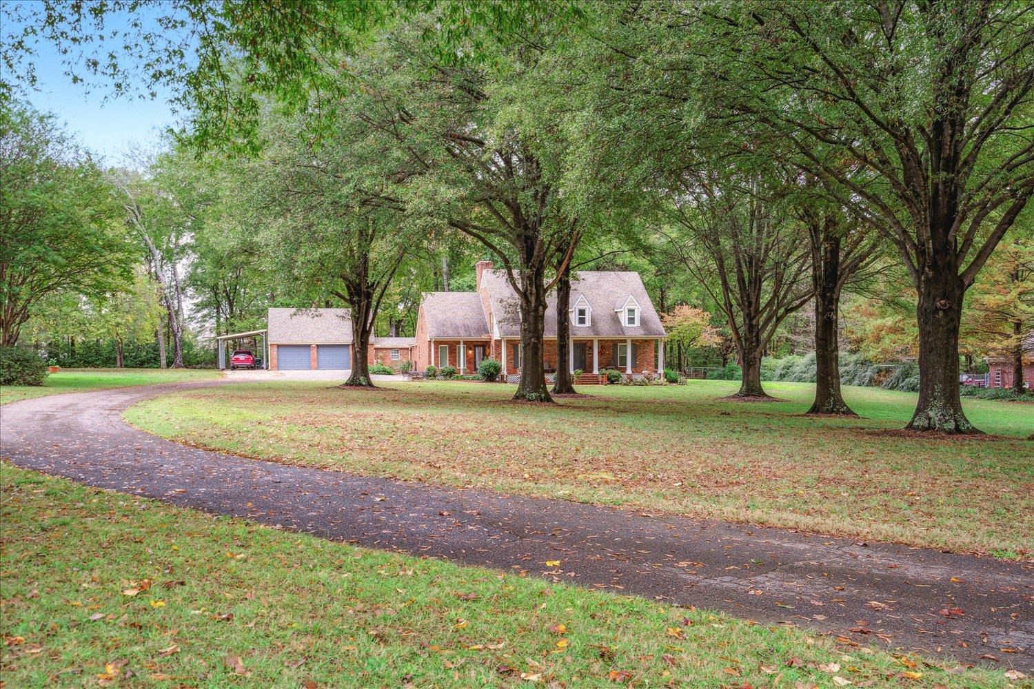 8450 Thor Road Memphis, TN 38018 - Photo 1 of 32 Cape cod home featuring a front yard