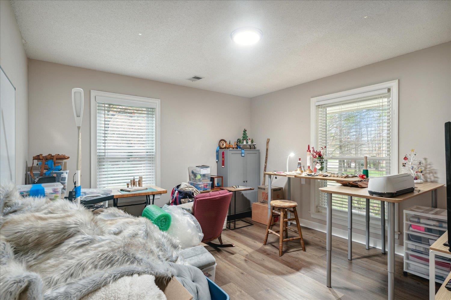 8450 Thor Road Memphis, TN 38018 - Photo 19 of 32 Bedroom featuring a textured ceiling and light hardwood / wood-style flooring