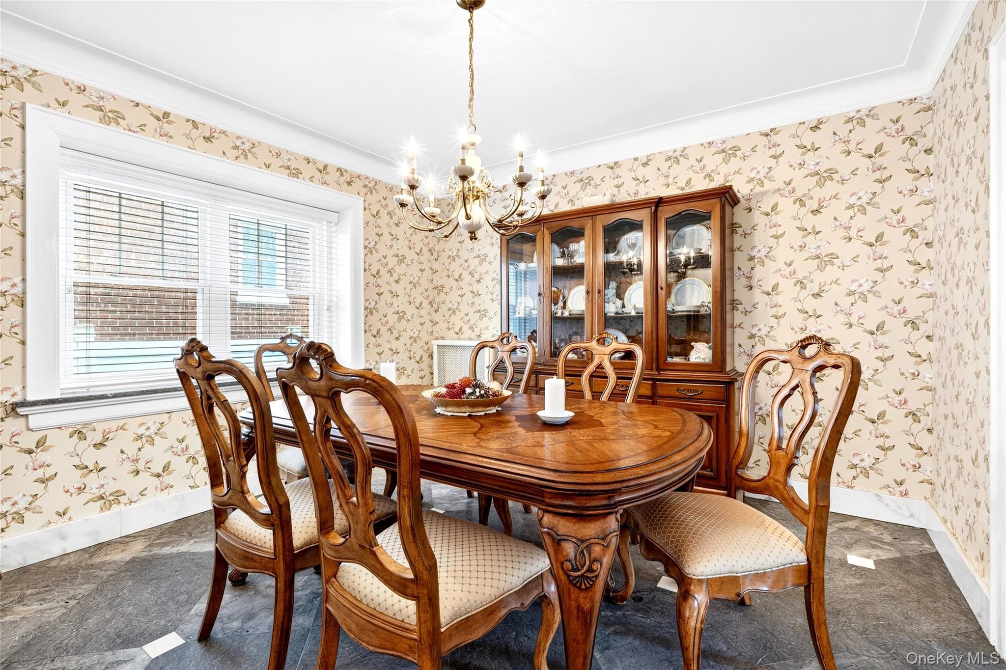 3334 Country Club Road Bronx, NY 10465 - Photo 12 of 49 Dining space featuring wallpapered walls, a chandelier, and crown molding
