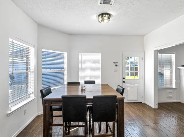 a bedroom with a bed and a ceiling fan